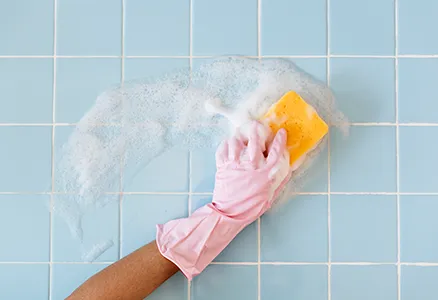 Bathtub and tile scrubbed during a bathroom cleaning