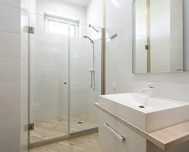 New bathroom tile and fixtures cleaned of grout haze